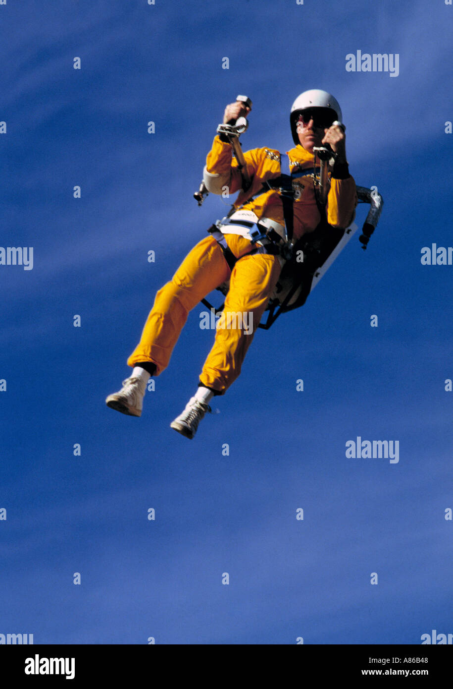 Man flying using jet pack on back his back at the opening of the 'on the streets' event in Birmingham Uk in the 1980's Stock Photo