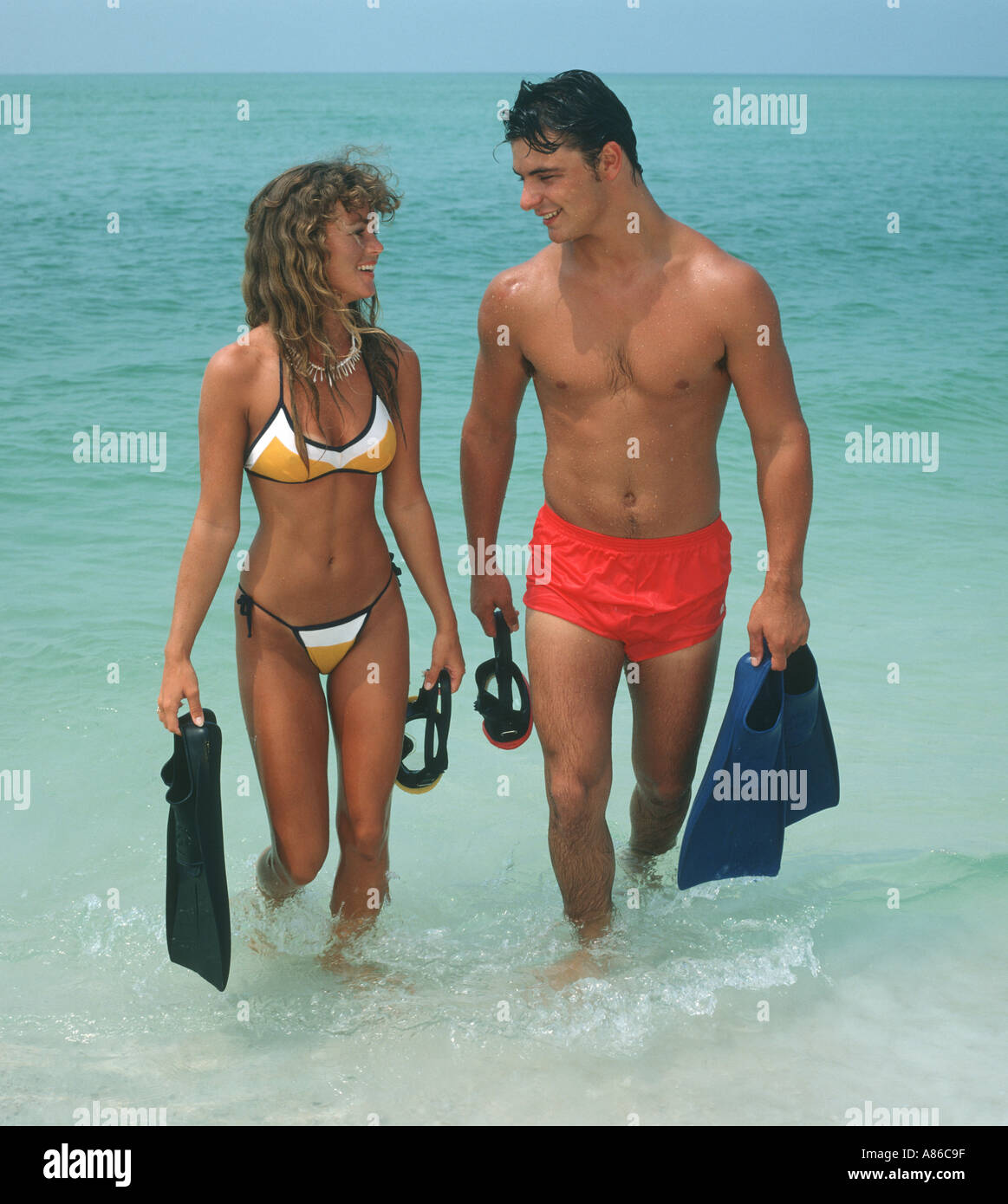 healthy young couple fins and masks at beach Stock Photo