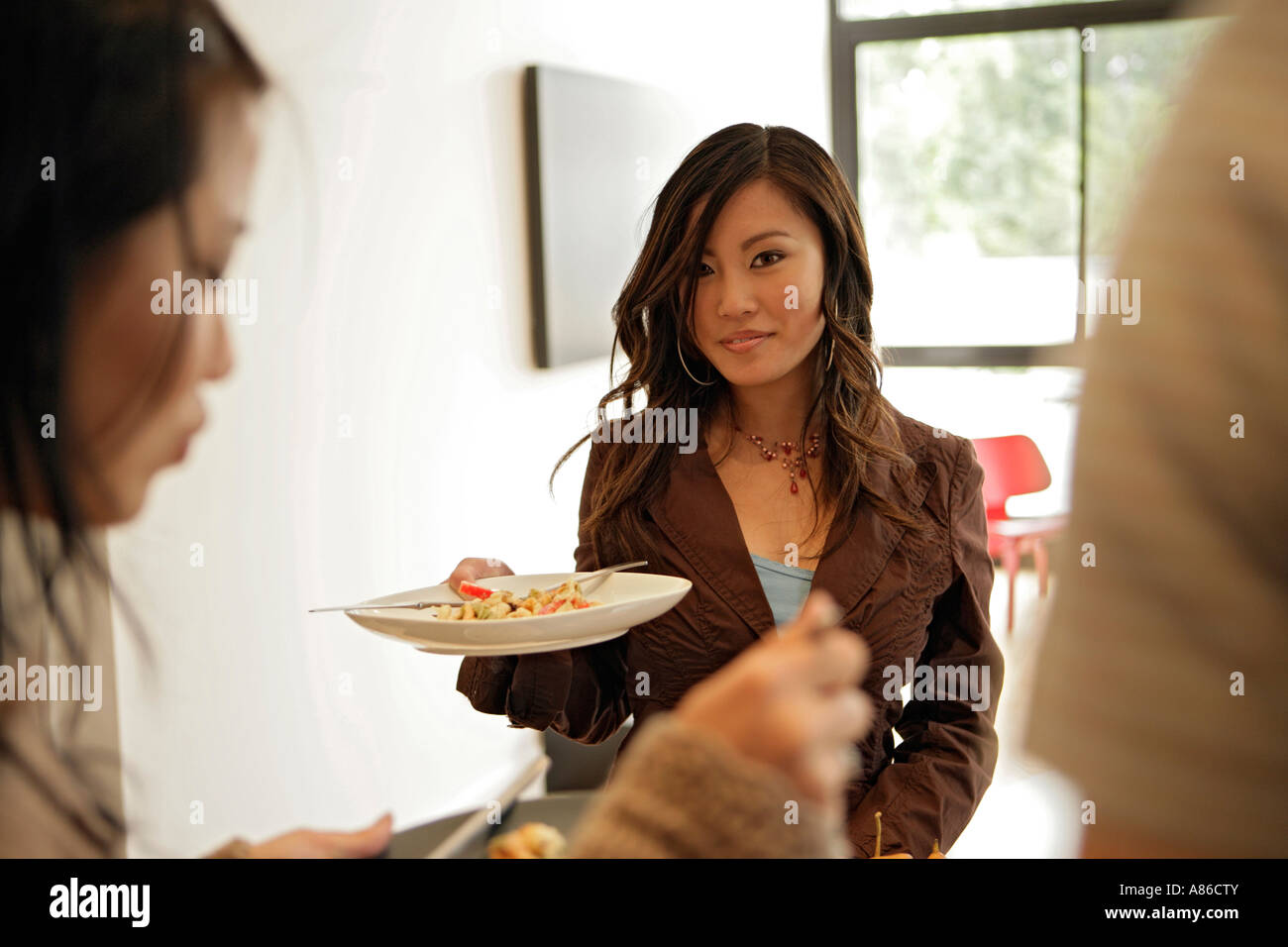 Three people having meal Stock Photo - Alamy