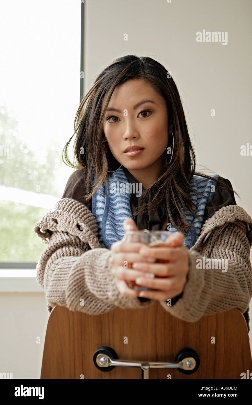 Front view of woman holding a glass Stock Photo