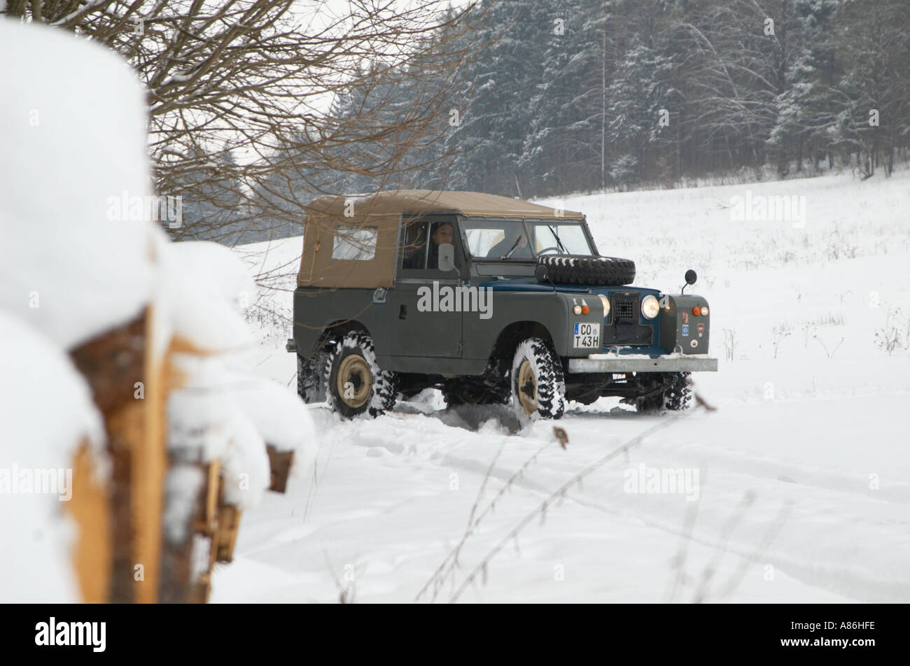 1965 Land Rover Series IIa short wheel base softtop on a winter journey through Thuringia, Germany 2005. HGW DE050087. Stock Photo