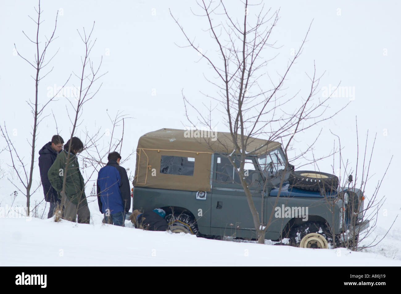 1965 Land Rover Series IIa short wheel base softtop stuck in snow. Germany, Thuringia 2005. HGW DE050116. Stock Photo