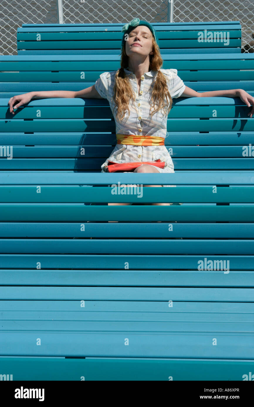 Woman sitting with her eye's closed Stock Photo - Alamy