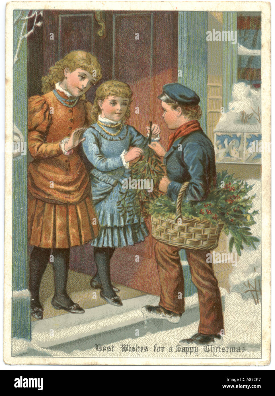 Christmas greeting card circa 1880.    Young boy trying to sell mistletoe to two young girls at front door. Stock Photo
