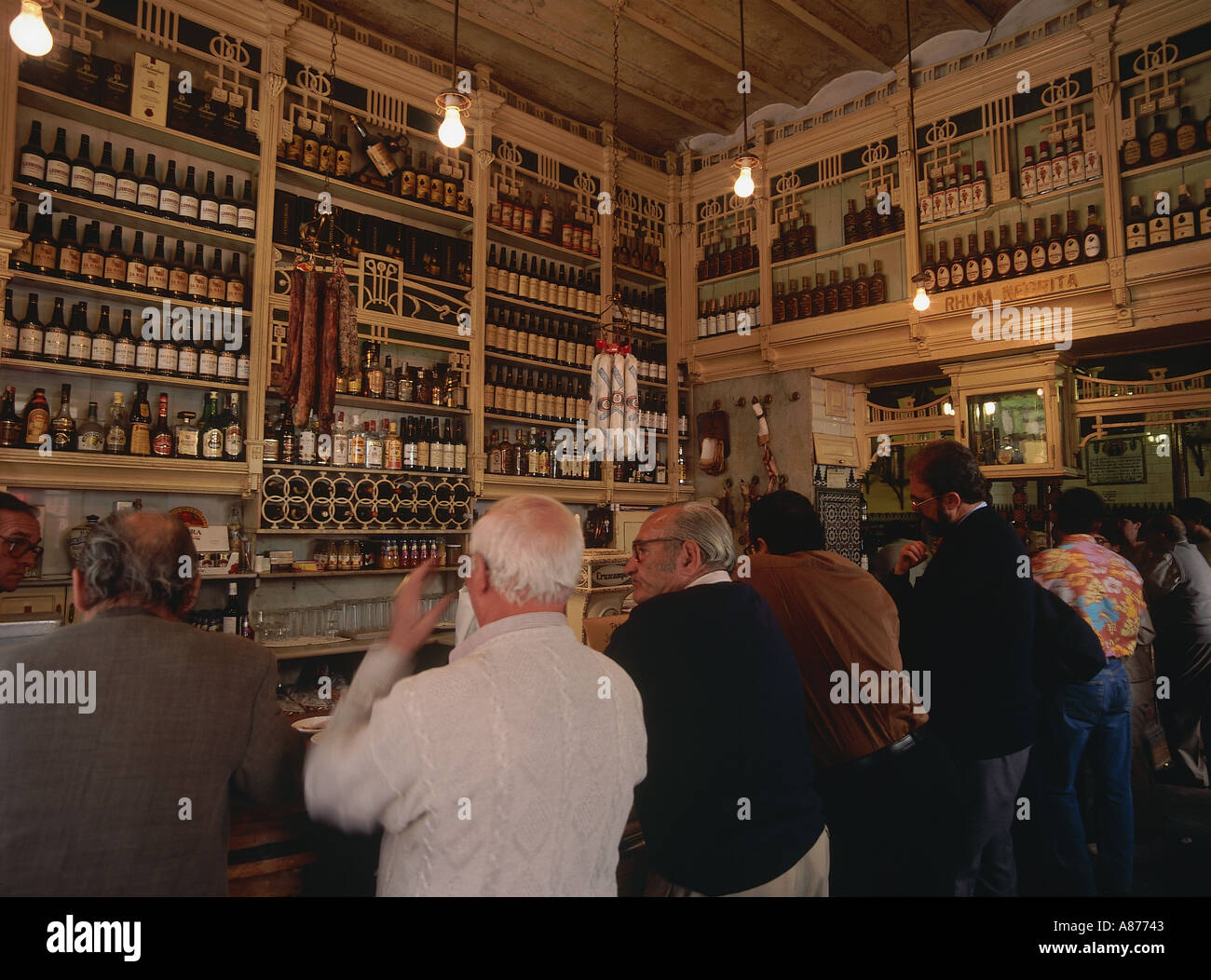 SPAIN Andalucia Seville Macarena District El Rinconcillo Bar where Tapas originates from with men at the bar counter Stock Photo