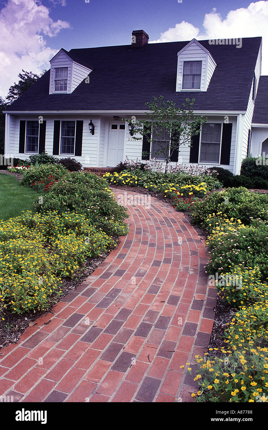 Brick Sidewalk Path To Front Door Of Home Stock Photo