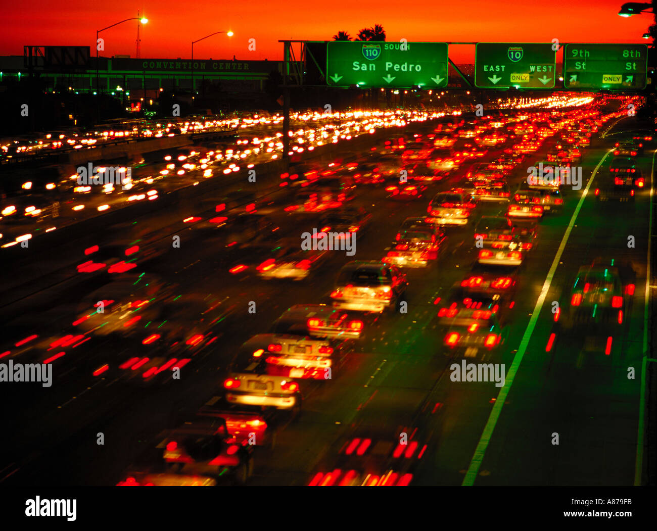 Blurred lights of traffic on a freeway at night Los Angeles California