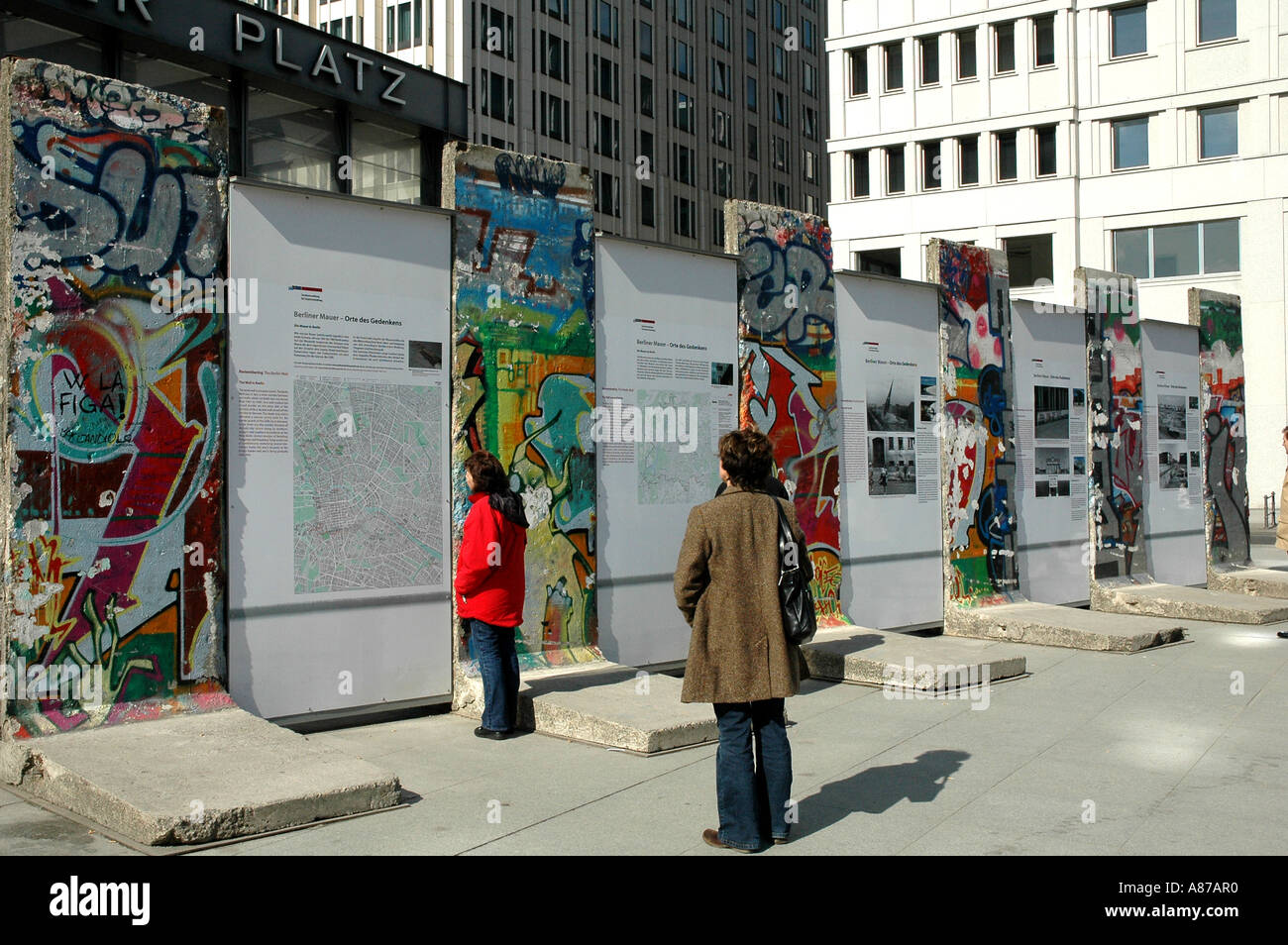 Viewing segments of the infamous Berlin Wall at Potsdamer Platz Germany Stock Photo