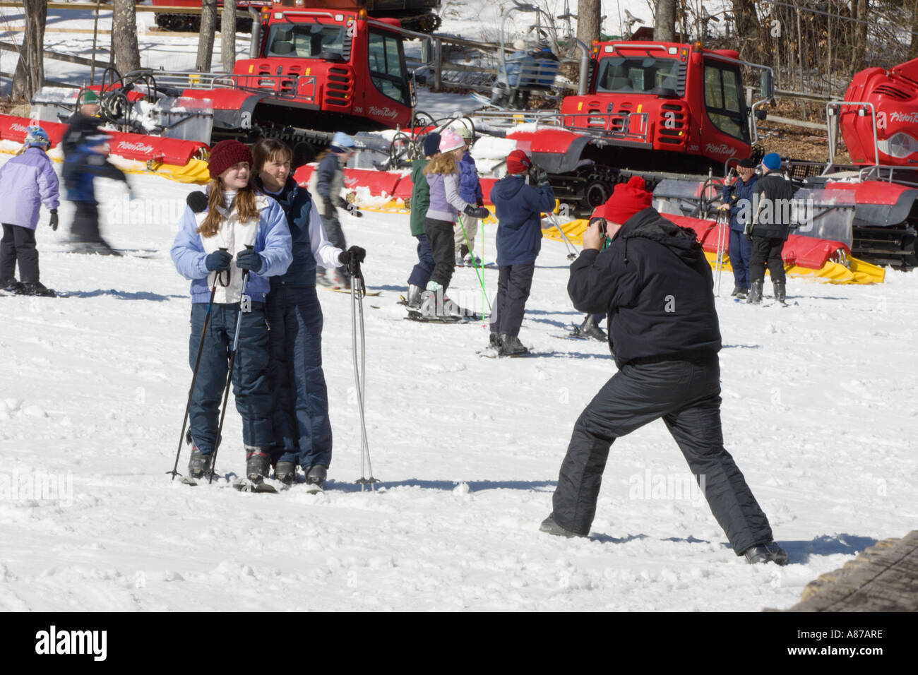 Man Photographs Two Posed Women On Ski Slopes At Sugar Mountain