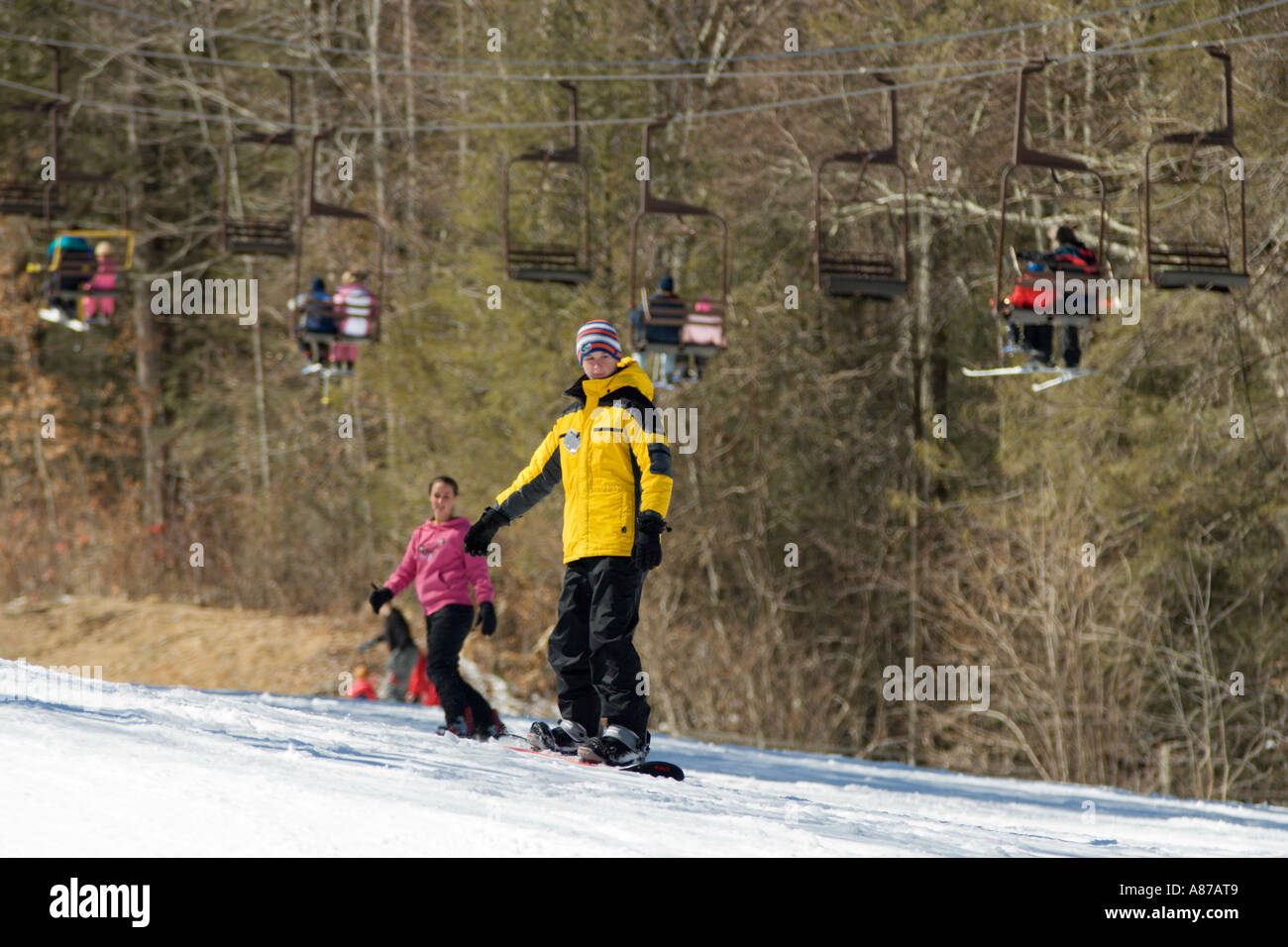 Young Boy And Girl Snowboarding At Sugar Mountain Resort In Banner