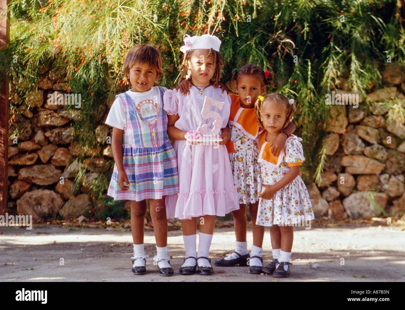 Portrait of four Dominican girls on the occasion of the birthday of one girl s fifth birthday in northern Dominican Republic Stock Photo