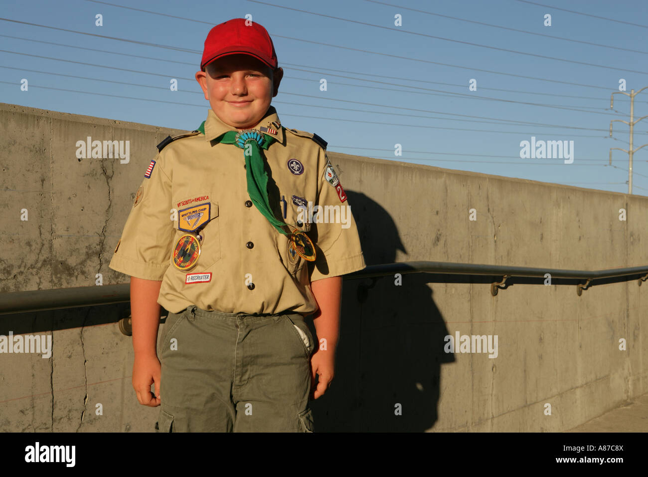 Boy scout standing outside Stock Photo