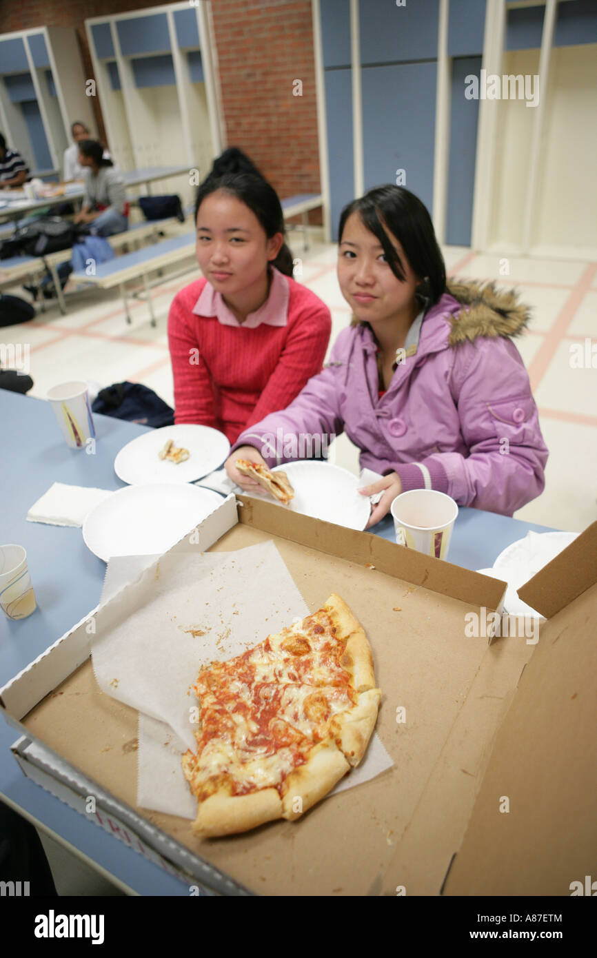Girls (1617) eating pizza in canteen, portrait Stock Photo Alamy