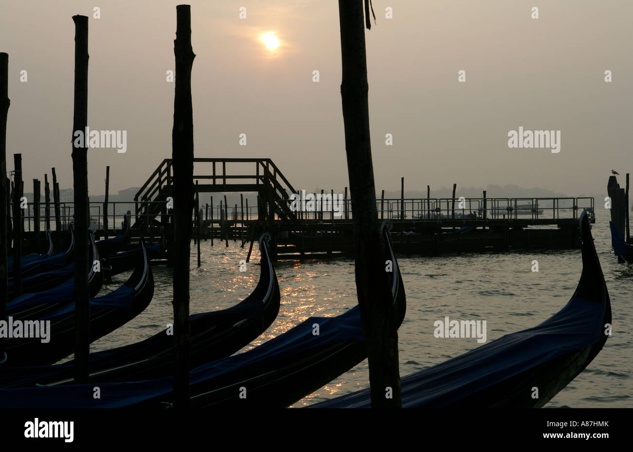 Silhouette of boats at sunset Stock Photo - Alamy