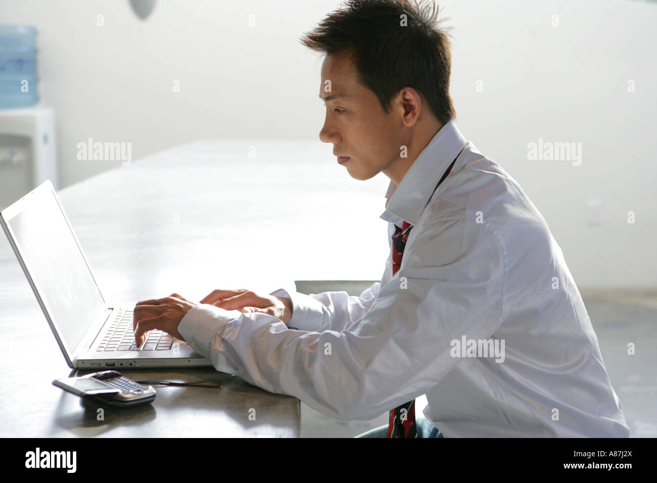 Young asian man laptop hi-res stock photography and images - Alamy