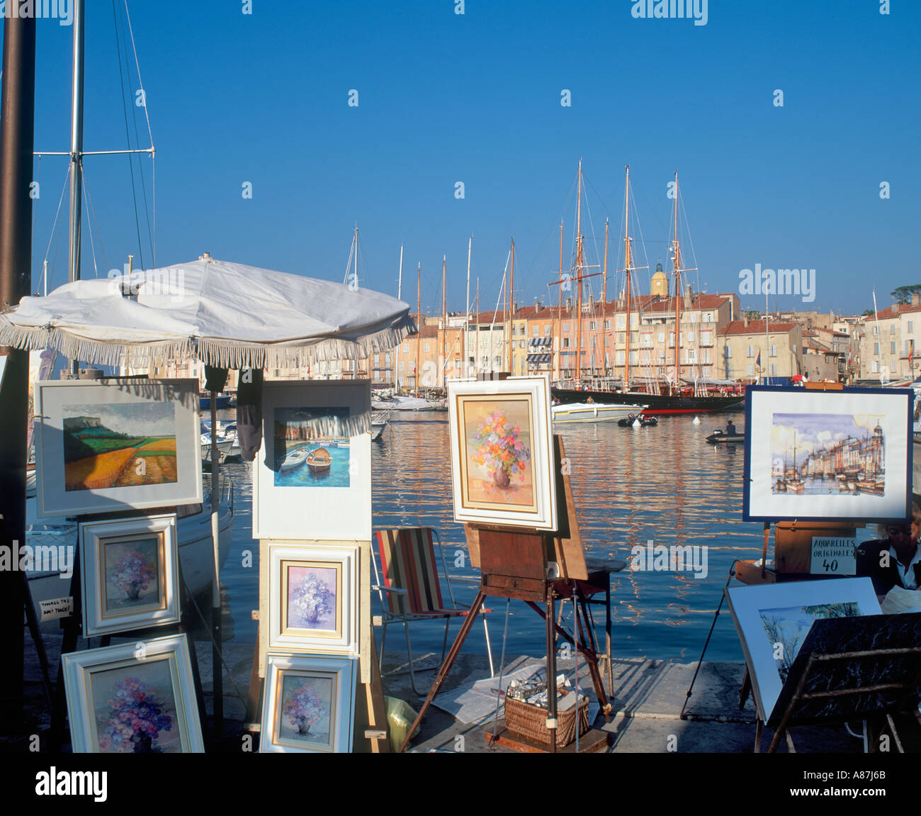 Artists' s easels in the early evening in the Old Harbour, St Tropez ,French Riviera, France Stock Photo