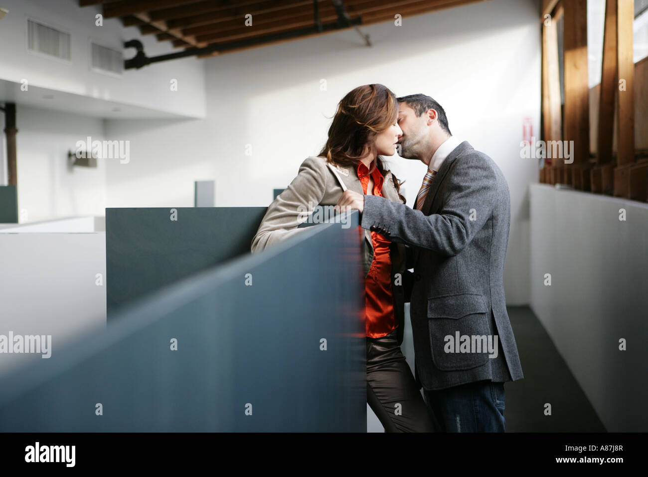 Two People Kissing In The Office Stock Photo Alamy