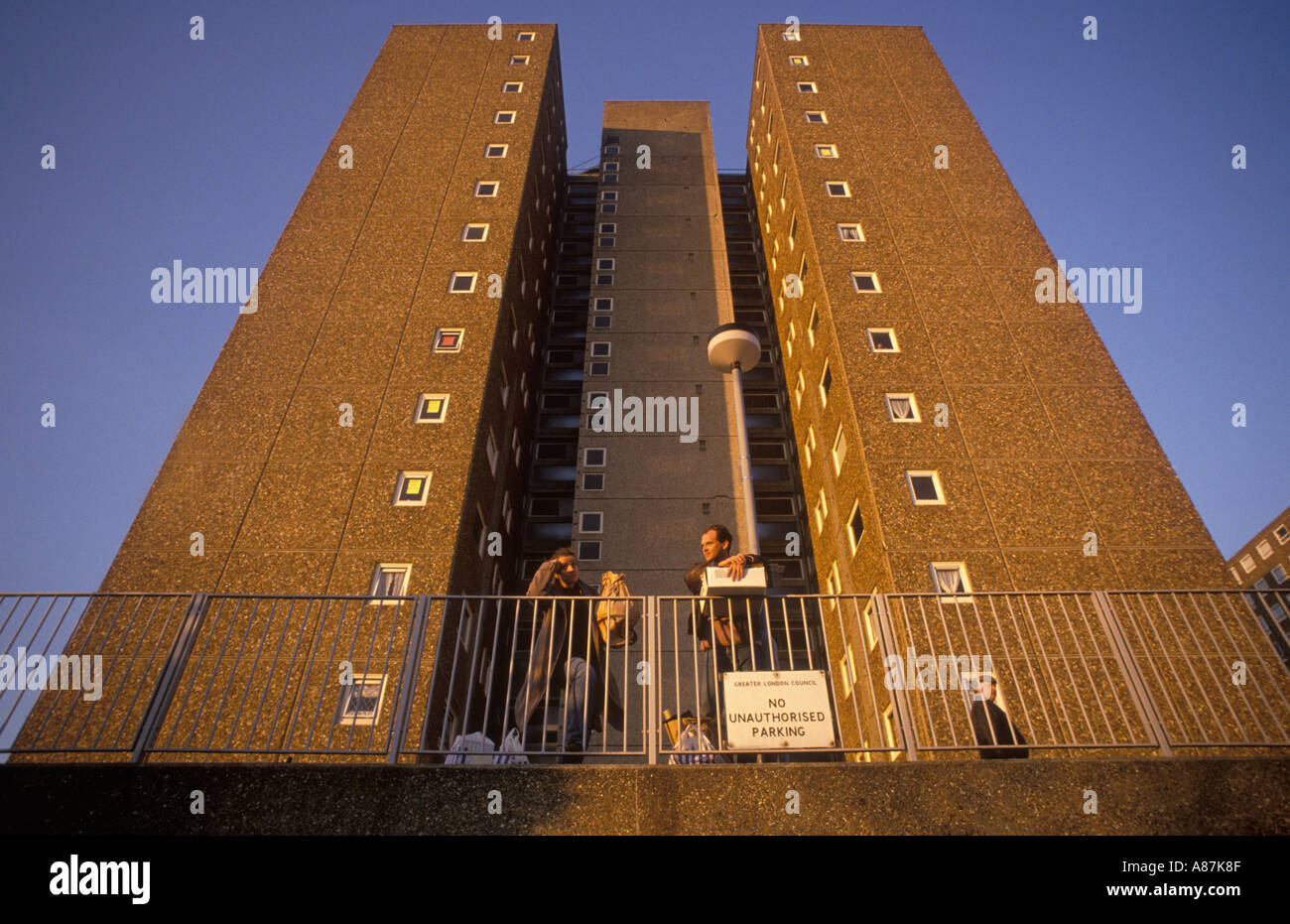 Council estate tower blocks residents talk outside their highrise in