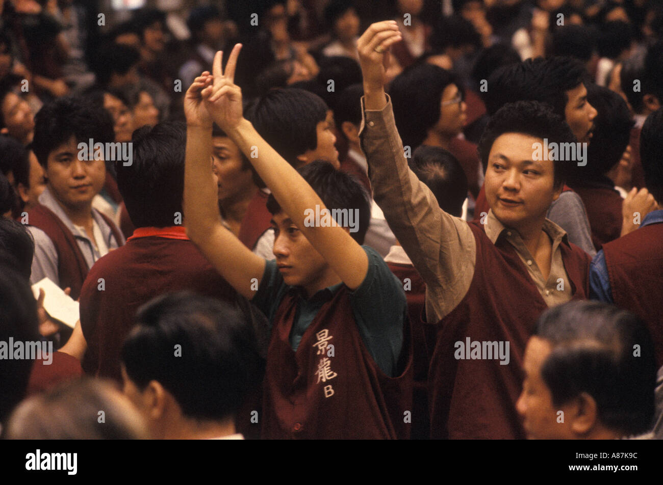 Traders at work gesturing on  trading floor The Gold Exchange Hong Kong Peoples Republic of China 1990s 90s HOMER SYKES Stock Photo