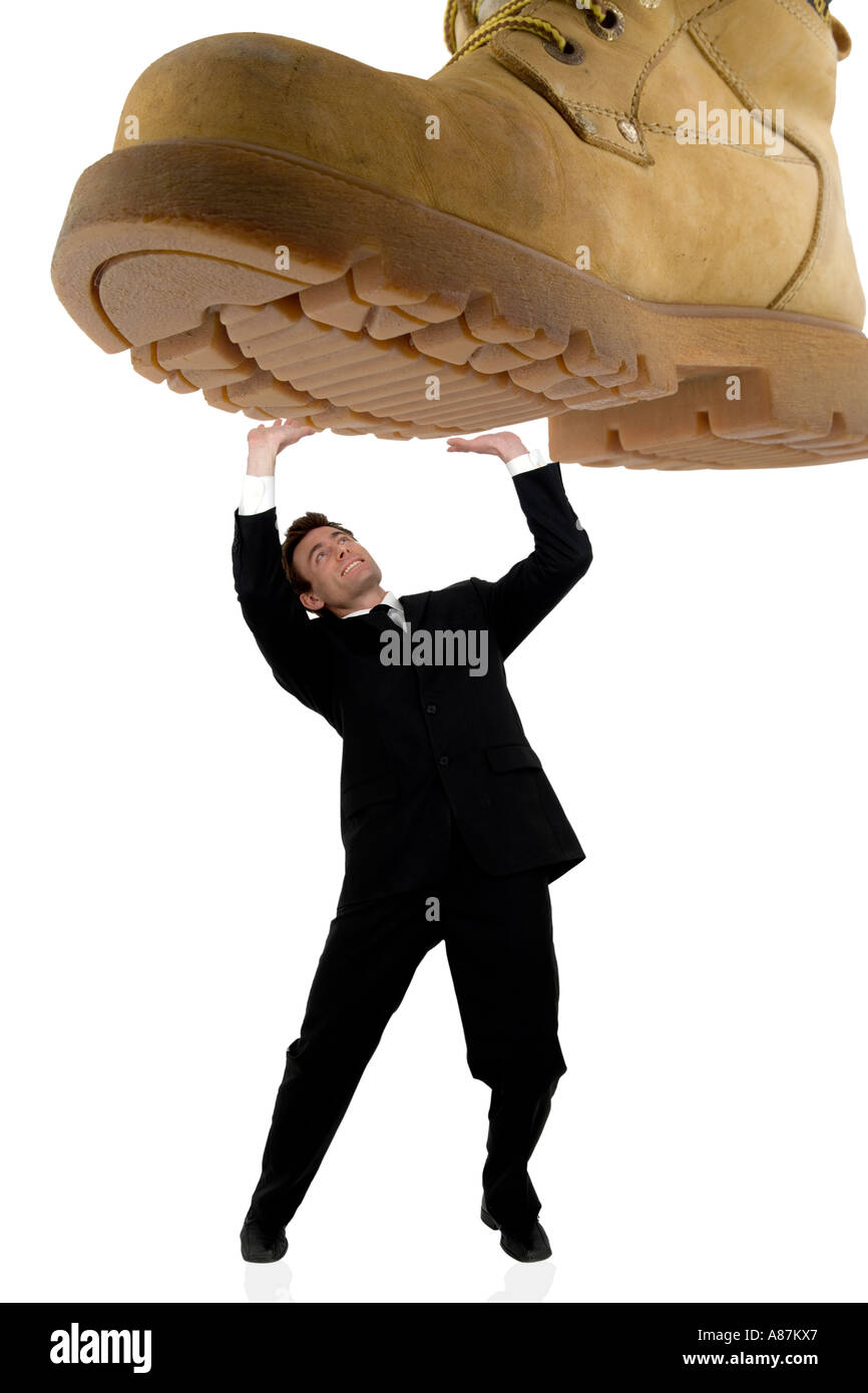 businessman being stepped on under pressure Stock Photo