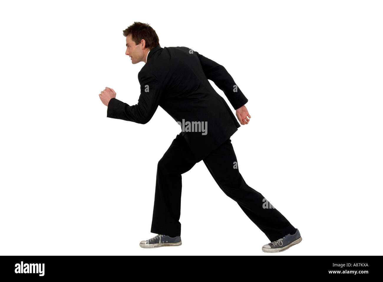 businessman in trainers running Stock Photo