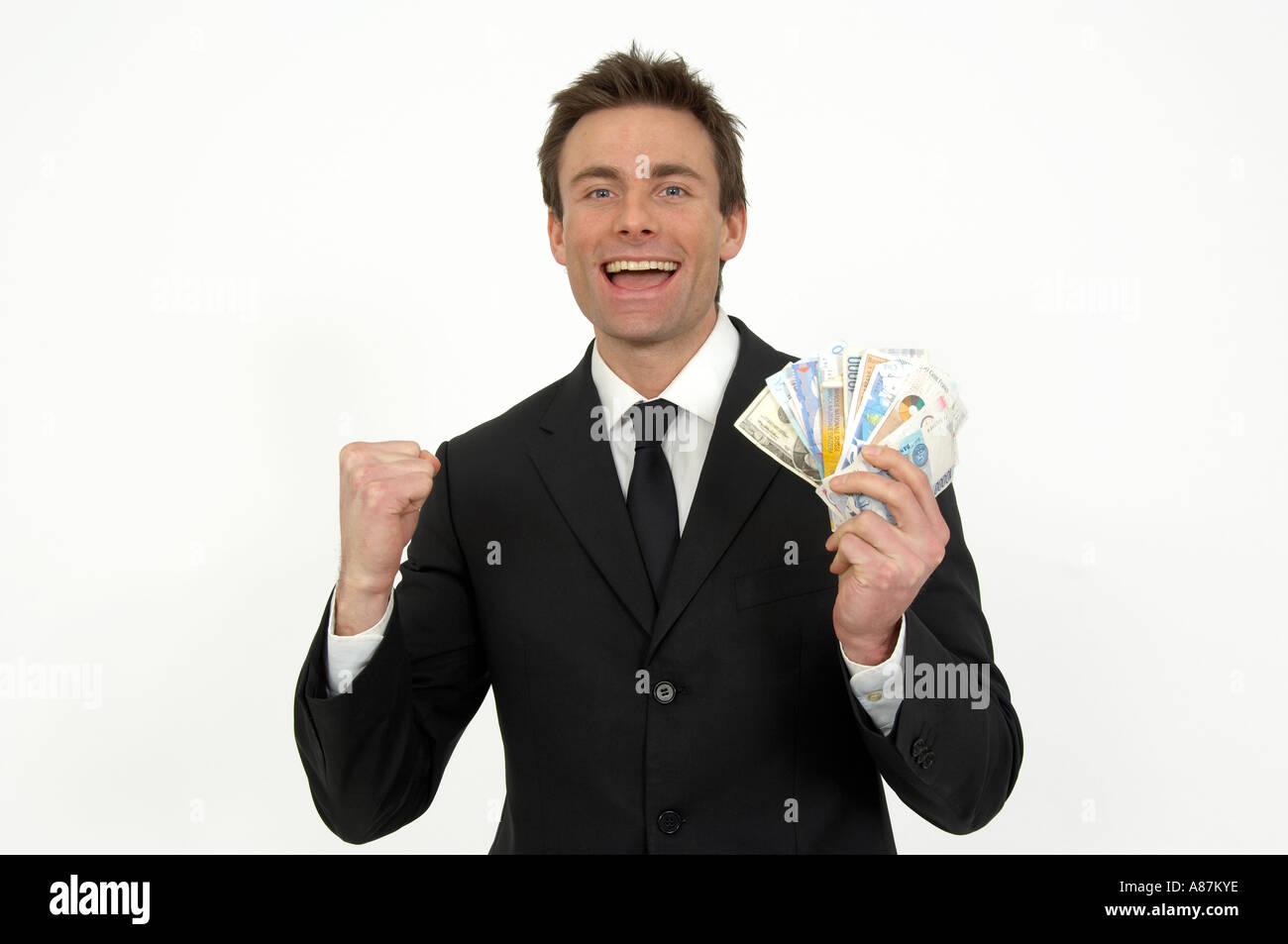 man punching the air with a fistful of bank notes winner Rob Wilkinson