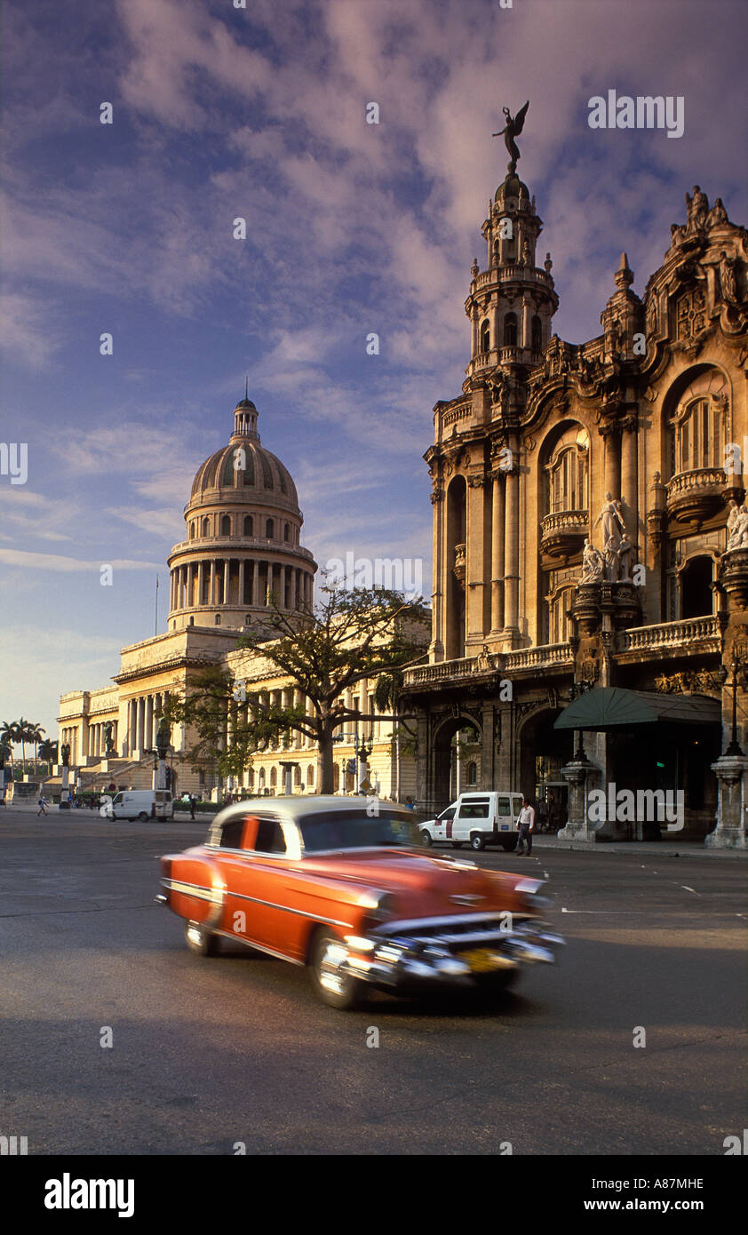 old cars passing the Gran Teatro Capitolio Habana Vieja Havana Cuba Stock Photo
