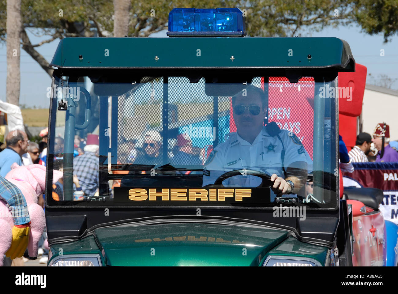 Sheriff deputy patrols the Florida State Fair in a golf cart style vehicle Stock Photo