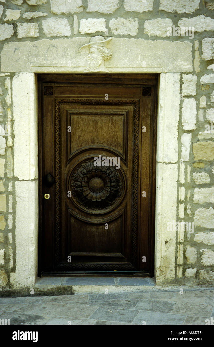 Ornately Carved Wooden Church Door With Carved Figurehead Above Rab 