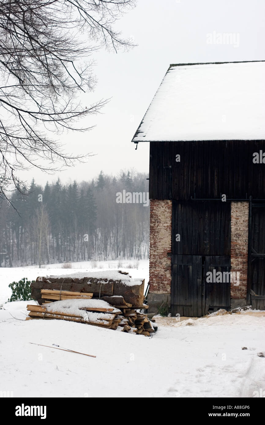 Snowy firewood wooden house Stock Photo