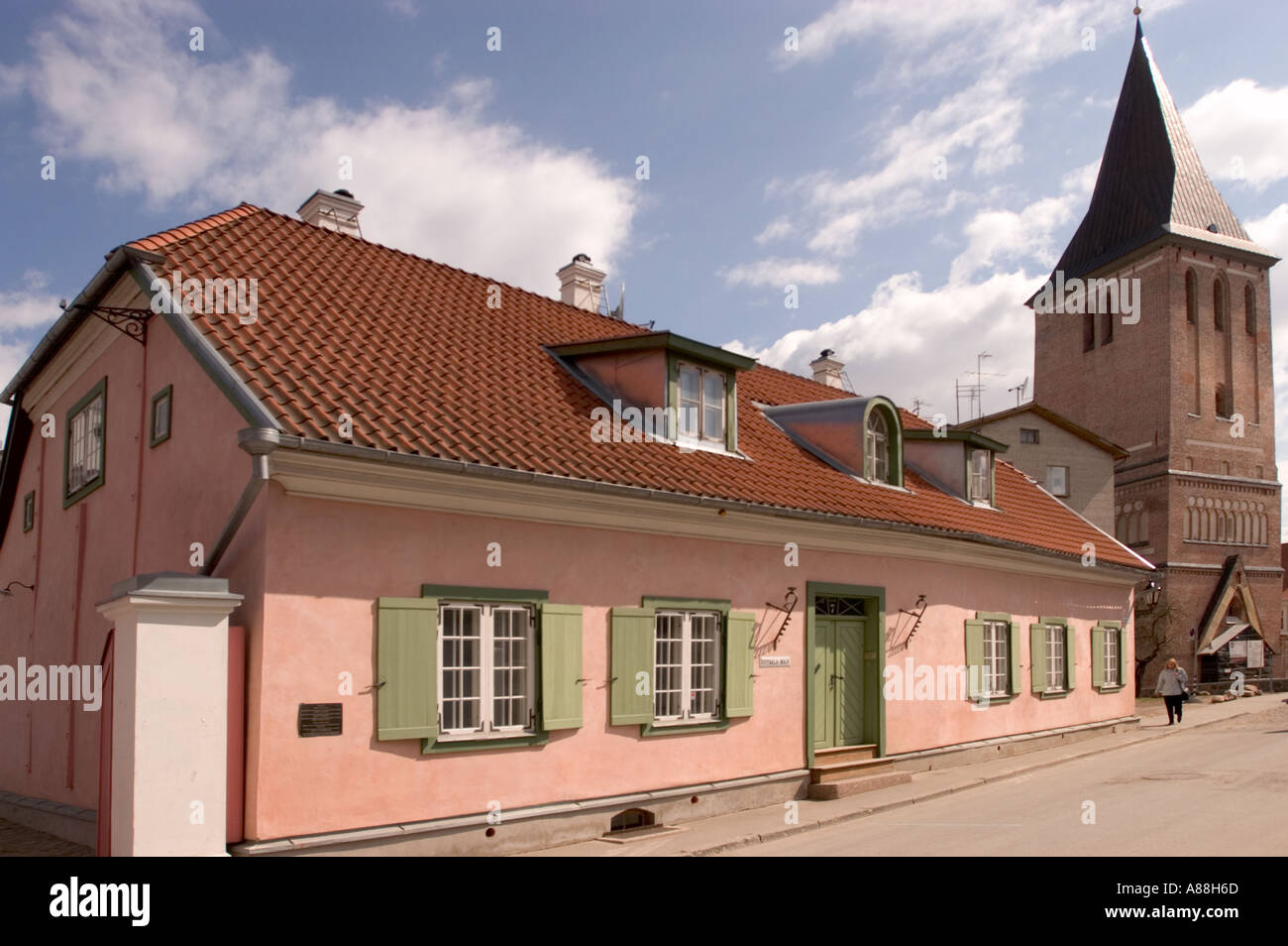 Uppsala House Pink old traditional house with red tiled rooftop and St