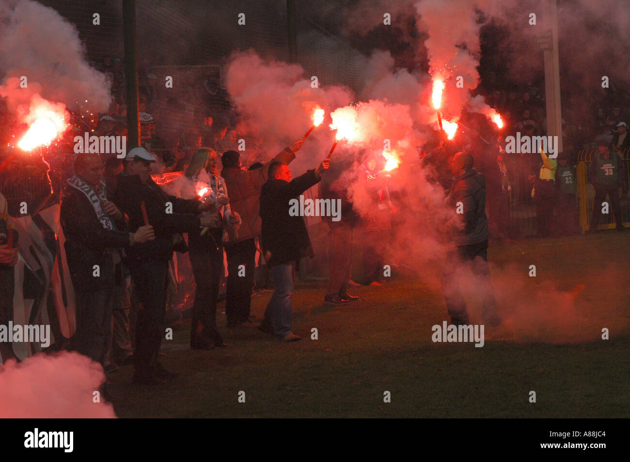 Football Fans Burning Fire On Soccer Stadium Stock Photo Alamy