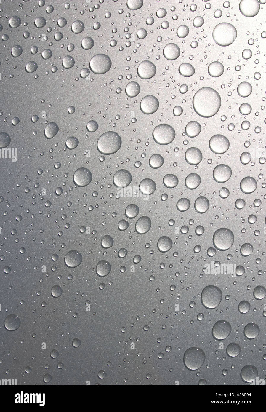 Round water drops on metal surface Stock Photo