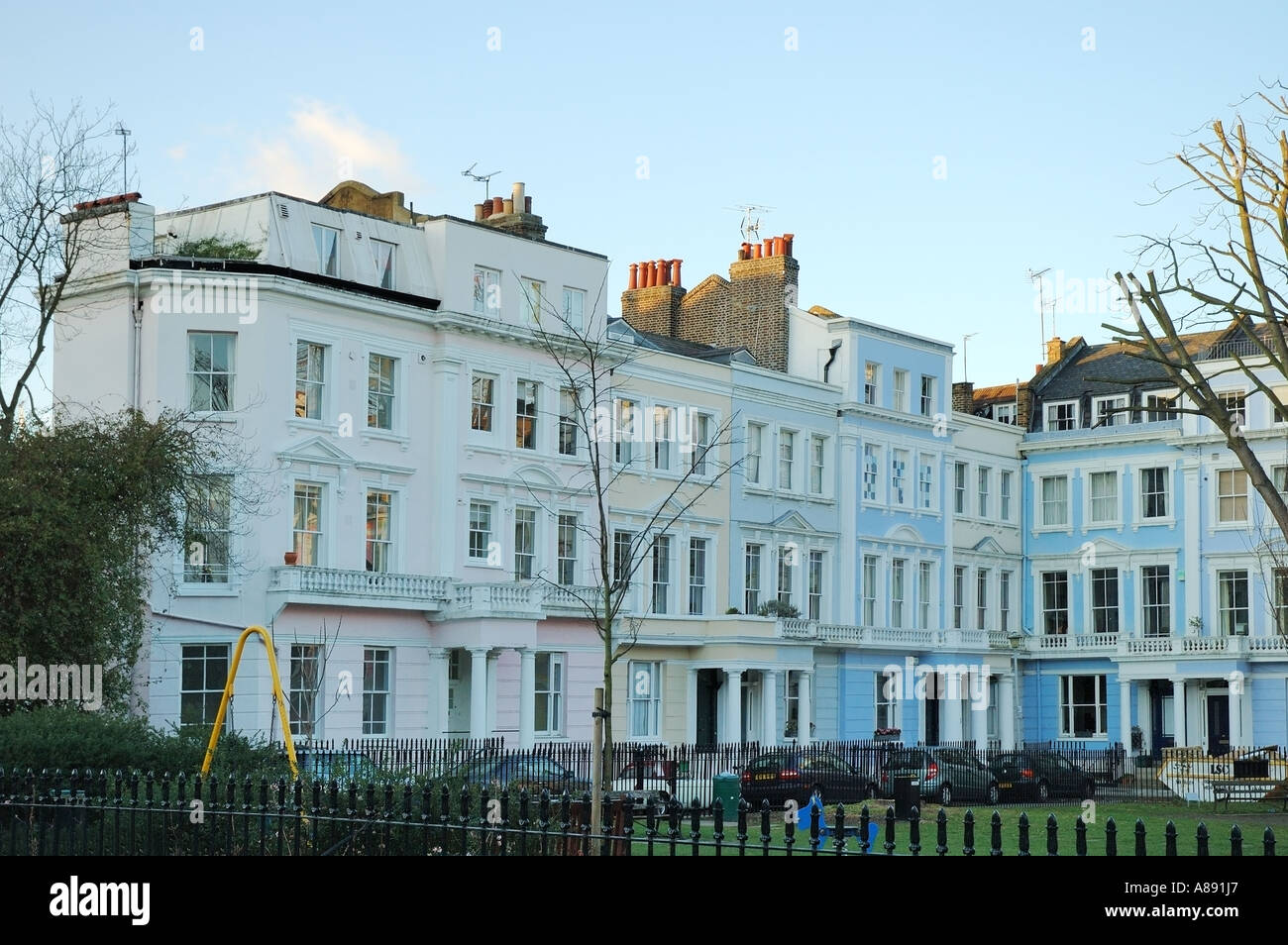 Terrace housing, pastel colour residential architecture properties at Primrose Hill London, Great Britain, UK, GB, England, EU Stock Photo