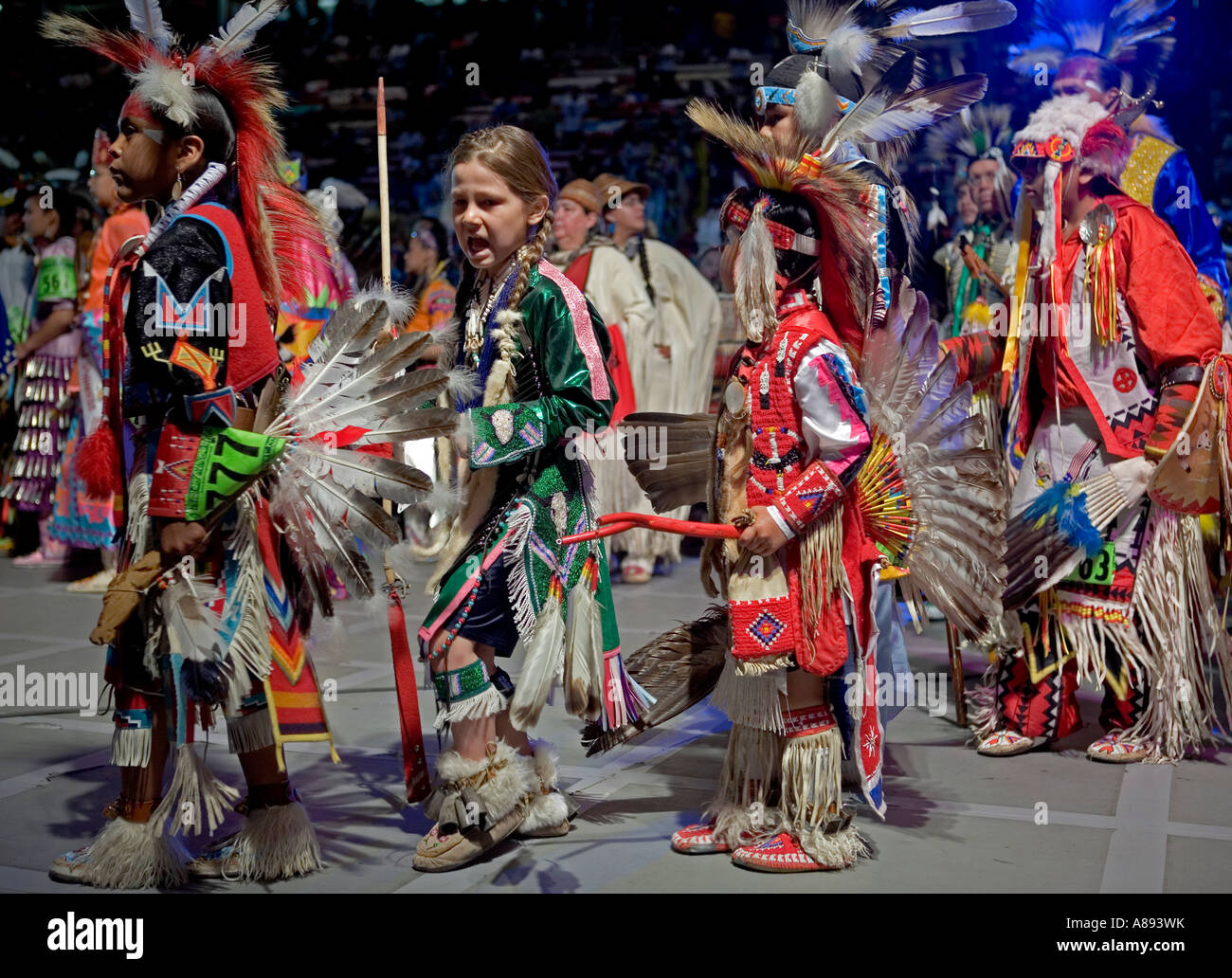 Participants in the annual Gathering of Nations powwow performing