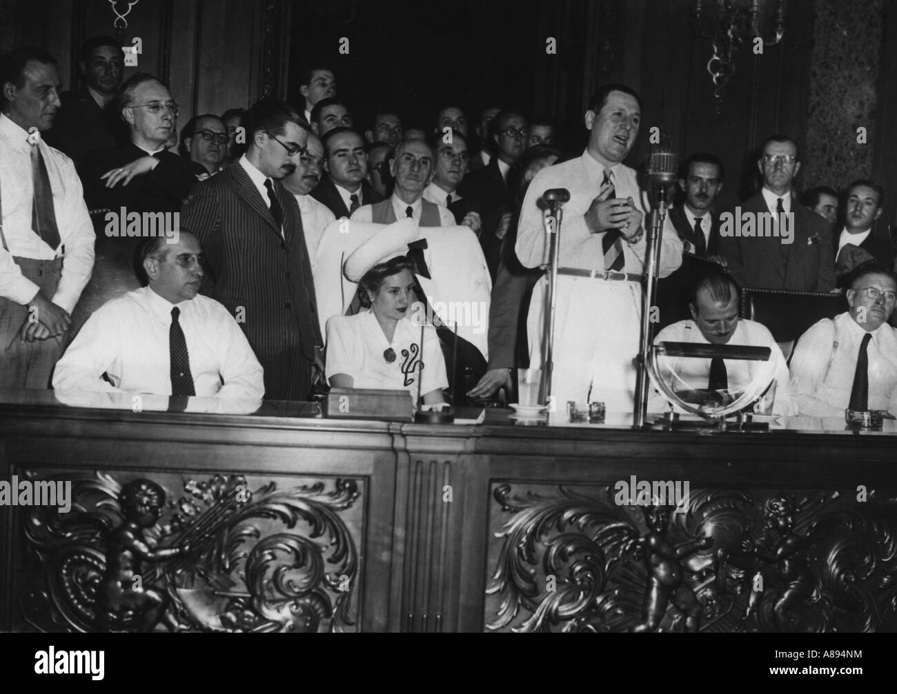 JUAN PERON Argentinian President makes a speech at 3rd anniversary of foundation of Ministry of Work. Wife Evita next to him. Stock Photo