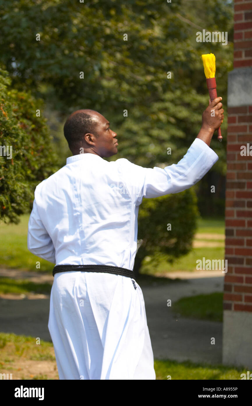 Priest Sprinkling Holy Water while giving a blessing Stock Photo Alamy