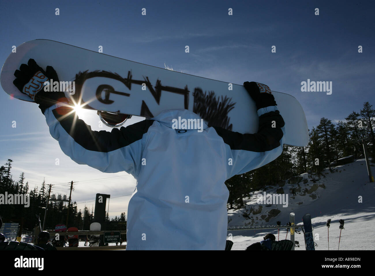 Person holding a snowboard Stock Photo - Alamy