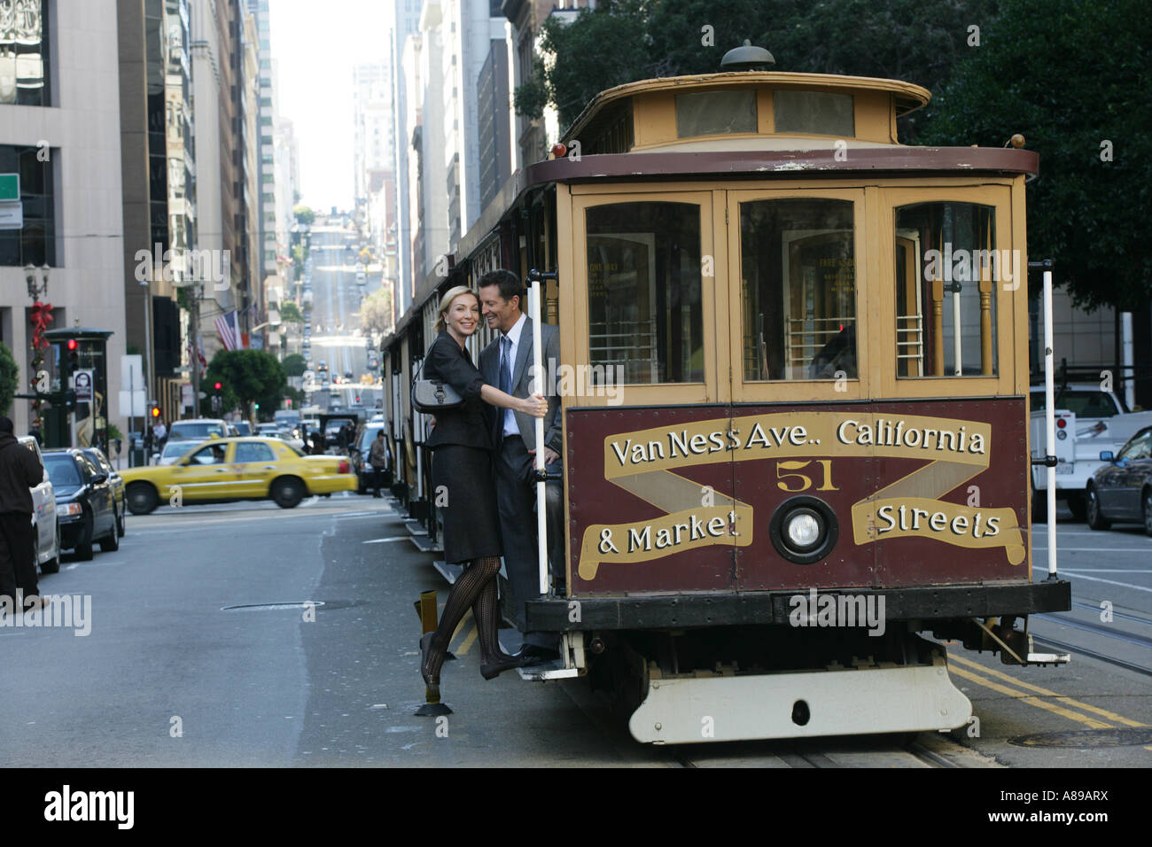 Couple riding a trolley car Stock Photo - Alamy