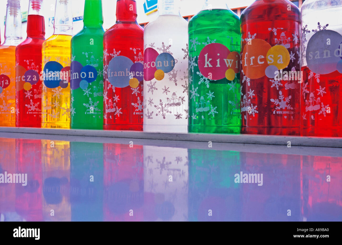 different colored bottles of flavoured drink syrup Stock Photo Alamy