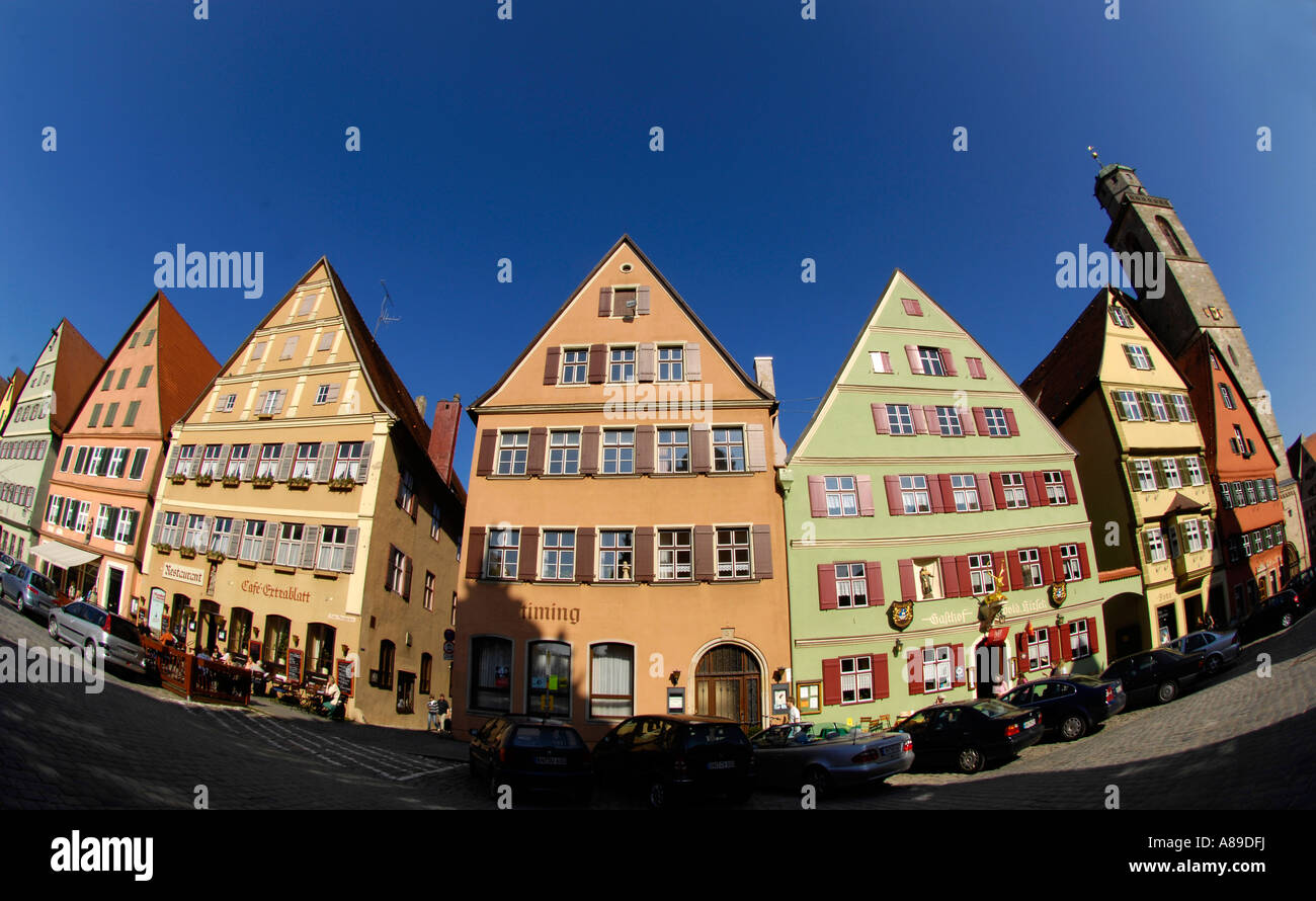 Row of houses with cathedral St. Georg in Dinkelsbuehl, Central Franconia, Bavaria, Germany Stock Photo