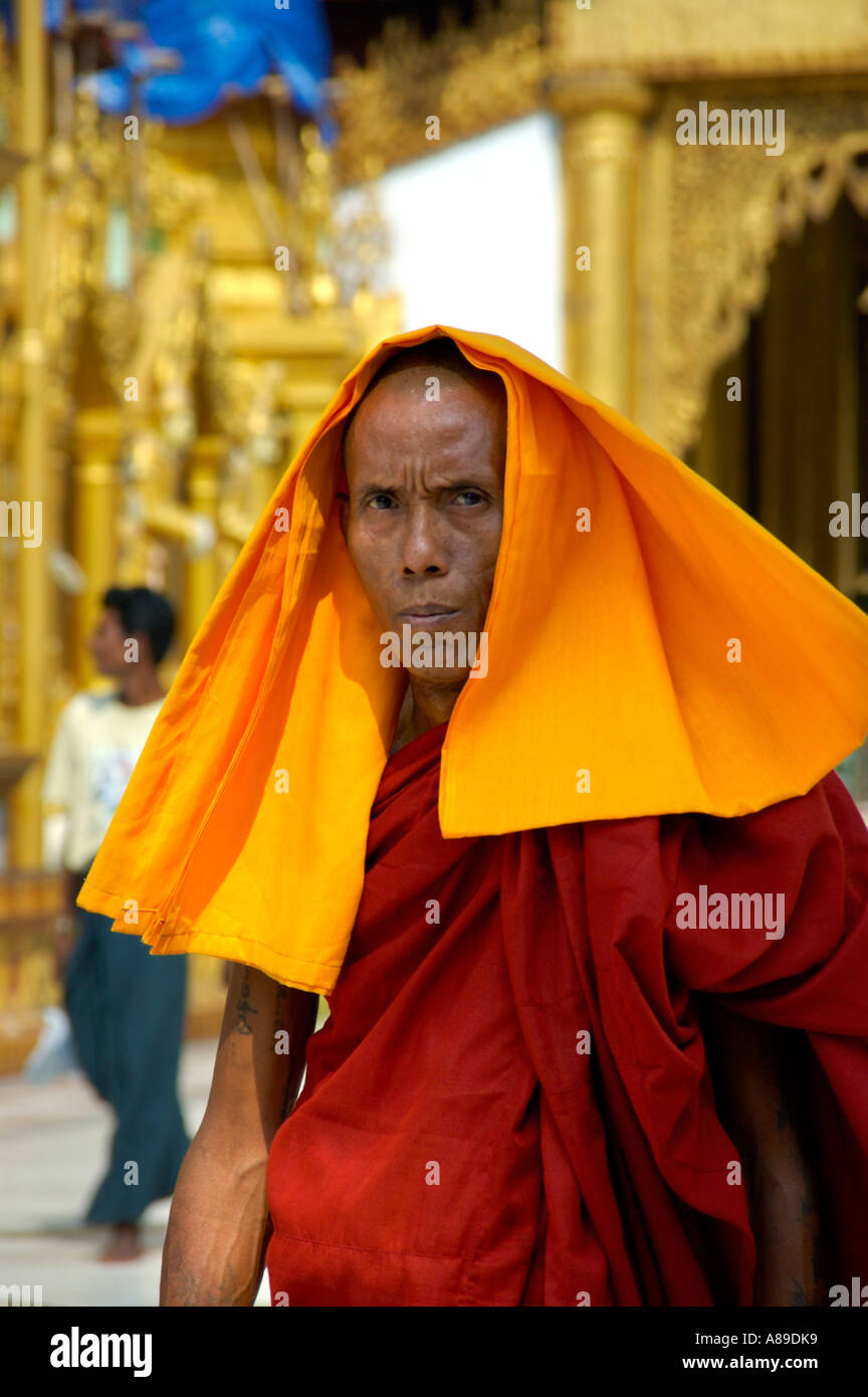 Buddhist monk in his robe and a towel over his head Shwedagon Pagoda