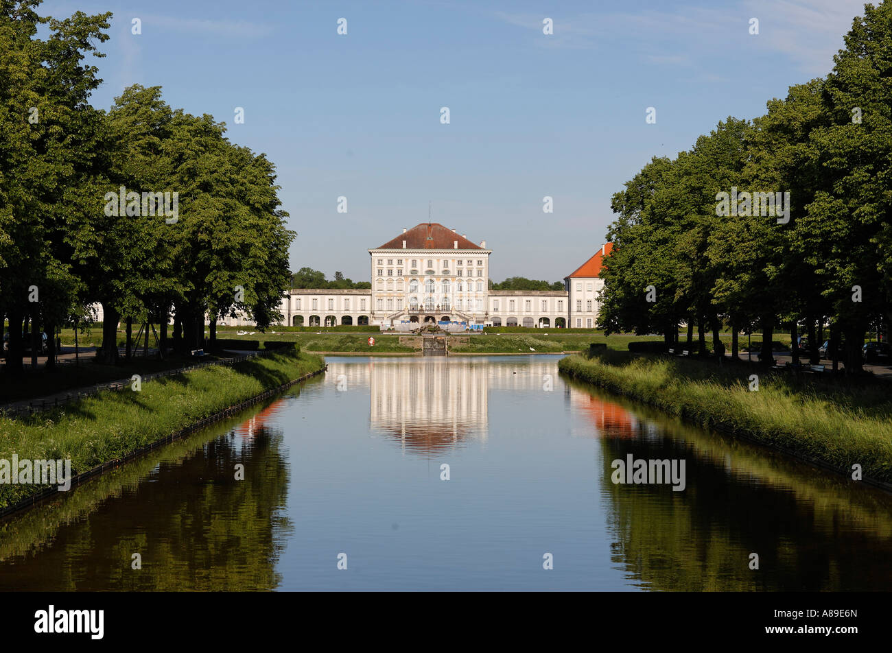 Canal of Castle Nymphenburg with parkway and middle part of Castle Nymphenburg in Munich, Upper Bavaria, Bavaria, Germany Stock Photo
