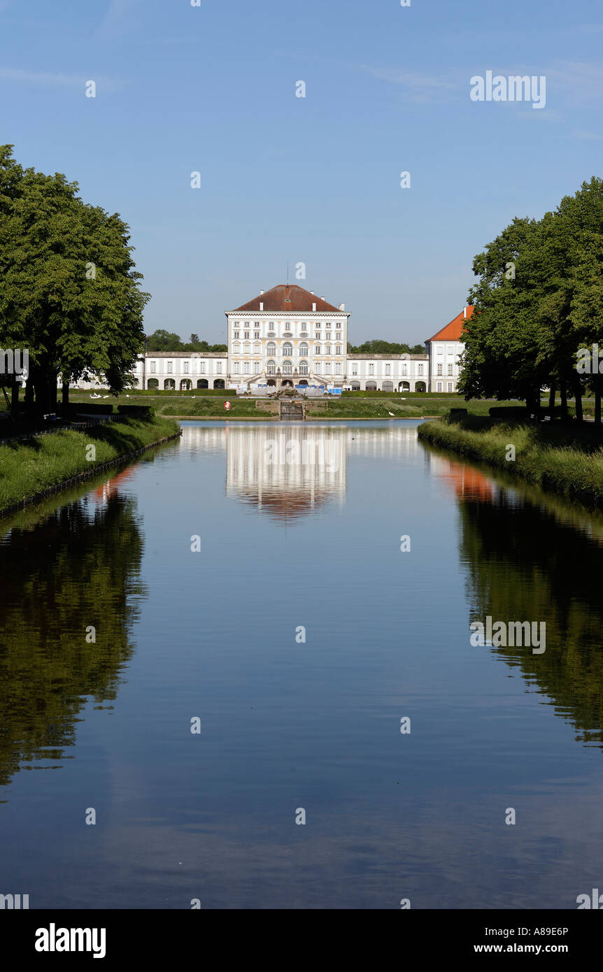 Canal of Castle Nymphenburg with parkway and middle part of Castle Nymphenburg in Munich, Upper Bavaria, Bavaria, Germany Stock Photo