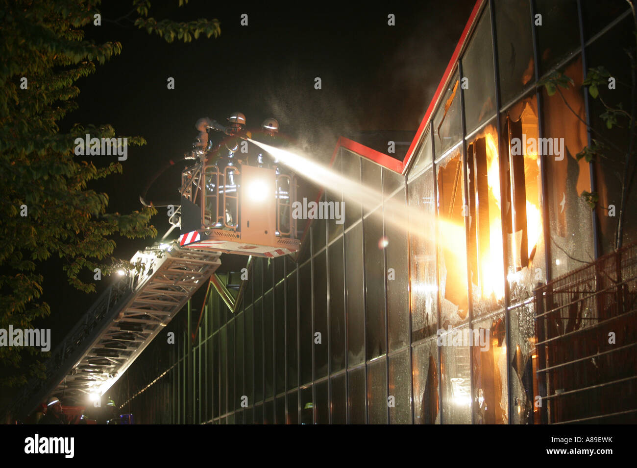 Firefighter put out the fire in an gardenmarket in Treis-Karden, Rhineland-Palatinate Germany Stock Photo