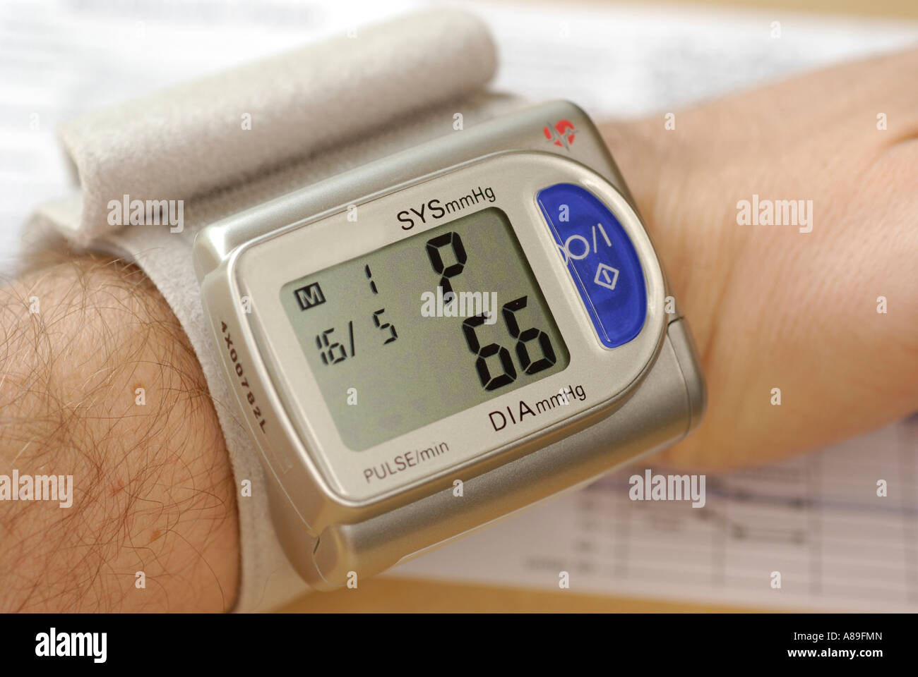 Blood pressure meter on wrist Stock Photo