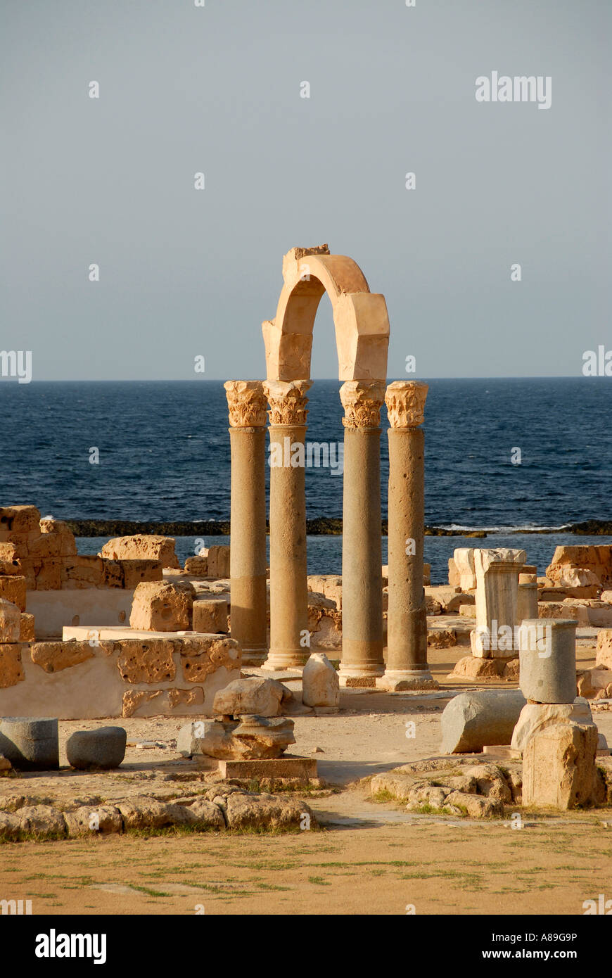 Pillars and arch at sea Sabratha Libya Stock Photo