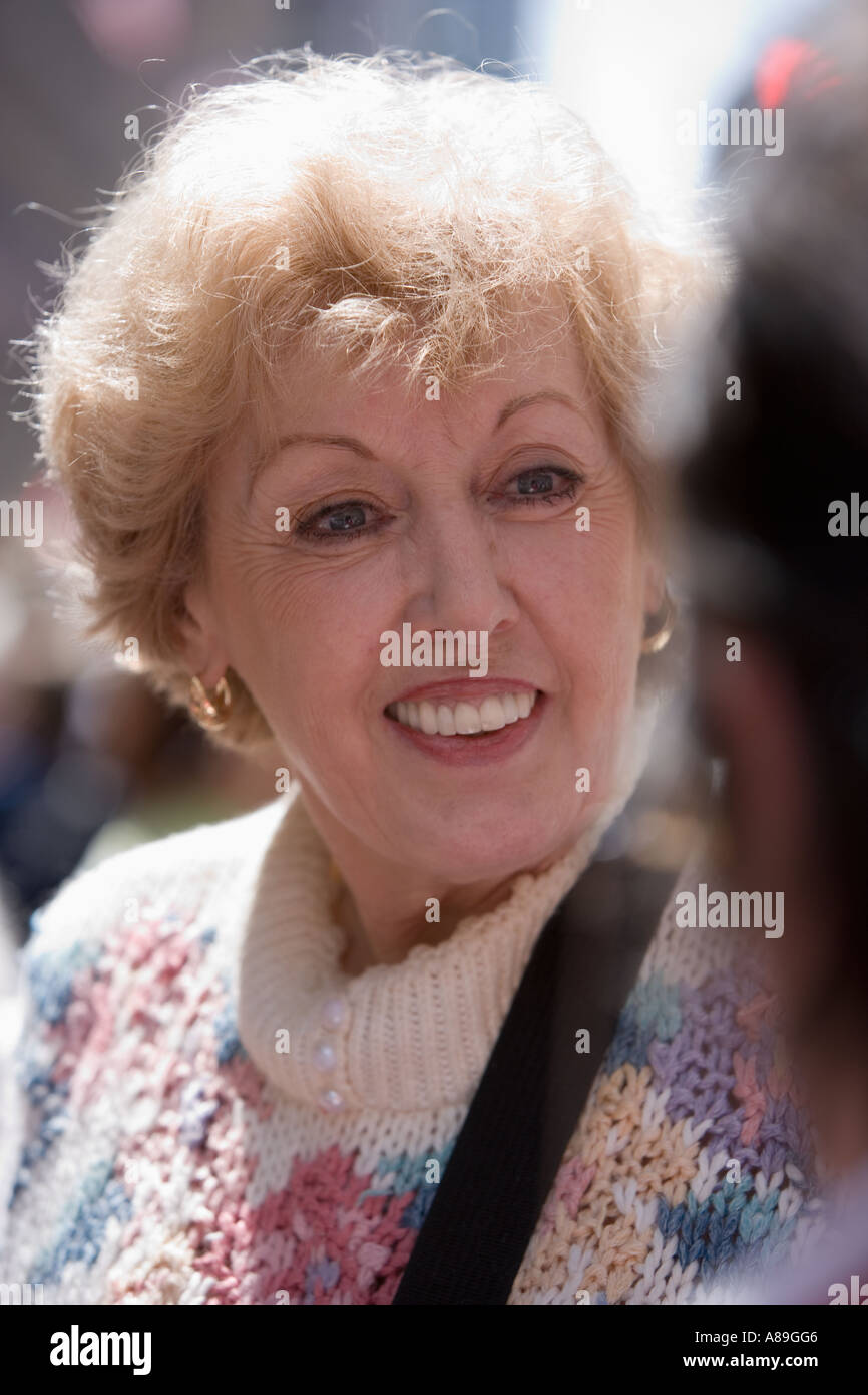 Older Caucasian woman in conversation Stock Photo
