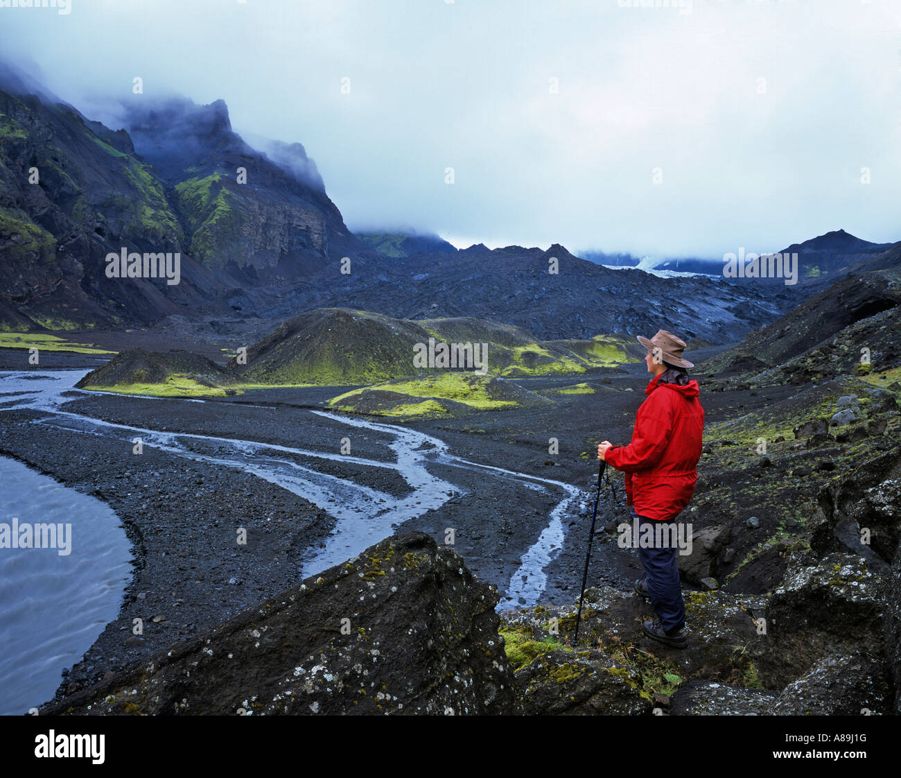 Hiker looks over the end moraine of the Thungnakvislajoekull, Thorsmoerk, Iceland Stock Photo