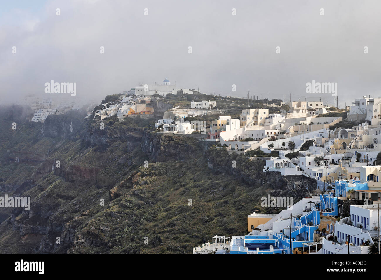 View of the caldera with morning fog, Firostefani, Santorini, Greece Stock Photo